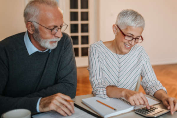 Happy Couple Calculating | Financial Information | Private Loans
