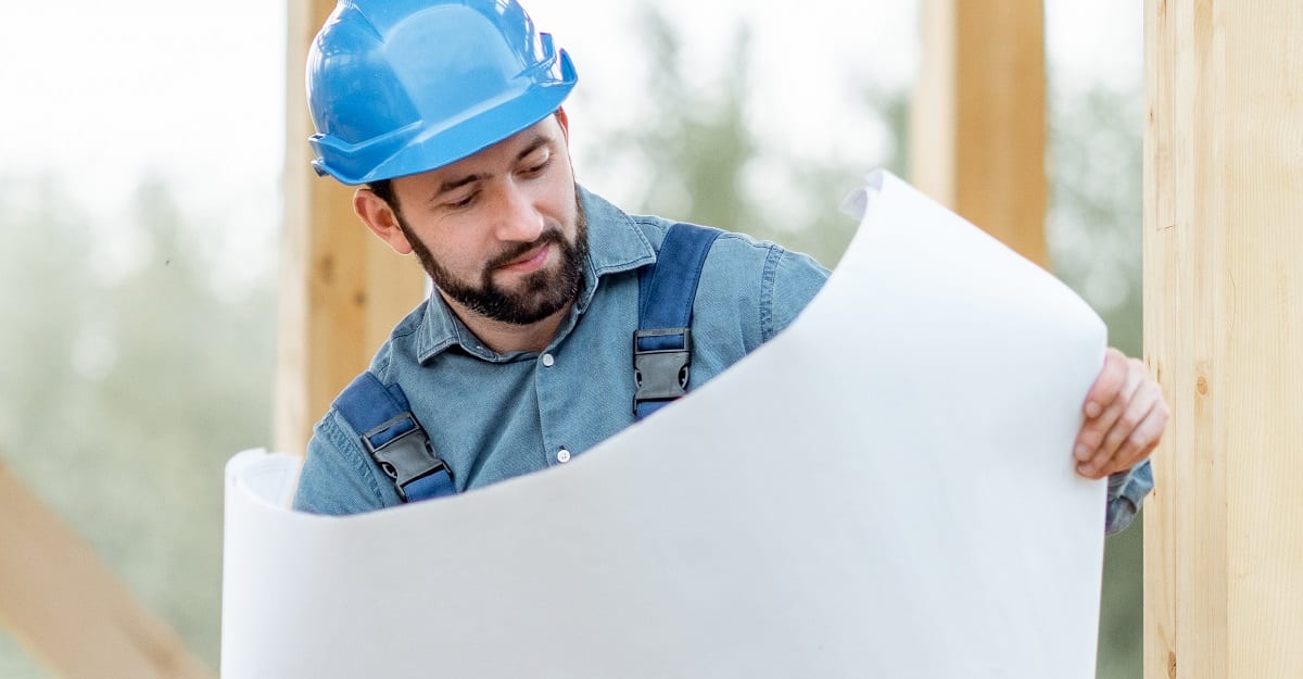 Builder looking at construction plans| Financial Information | Tiger Finance