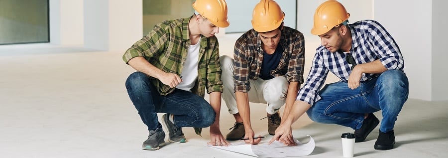 Construction engineers working over development plans | Financial Information | Tiger Finance