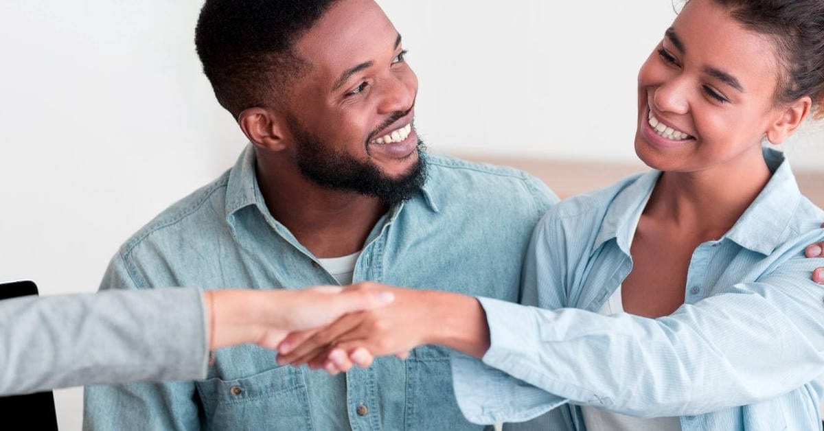 Couple signing a business loan| Financial Information | Tiger Finance