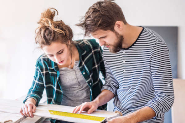 Couple looking at plans | Financial Information | Tiger Finance