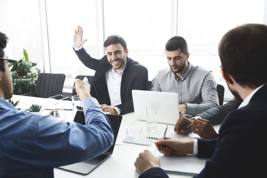 Business owner raising hand and asking question about Caveat Loan