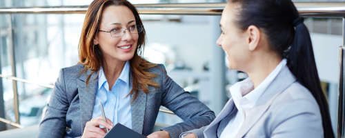 Happy Women Talking Business | Financial Information | Tiger Finance