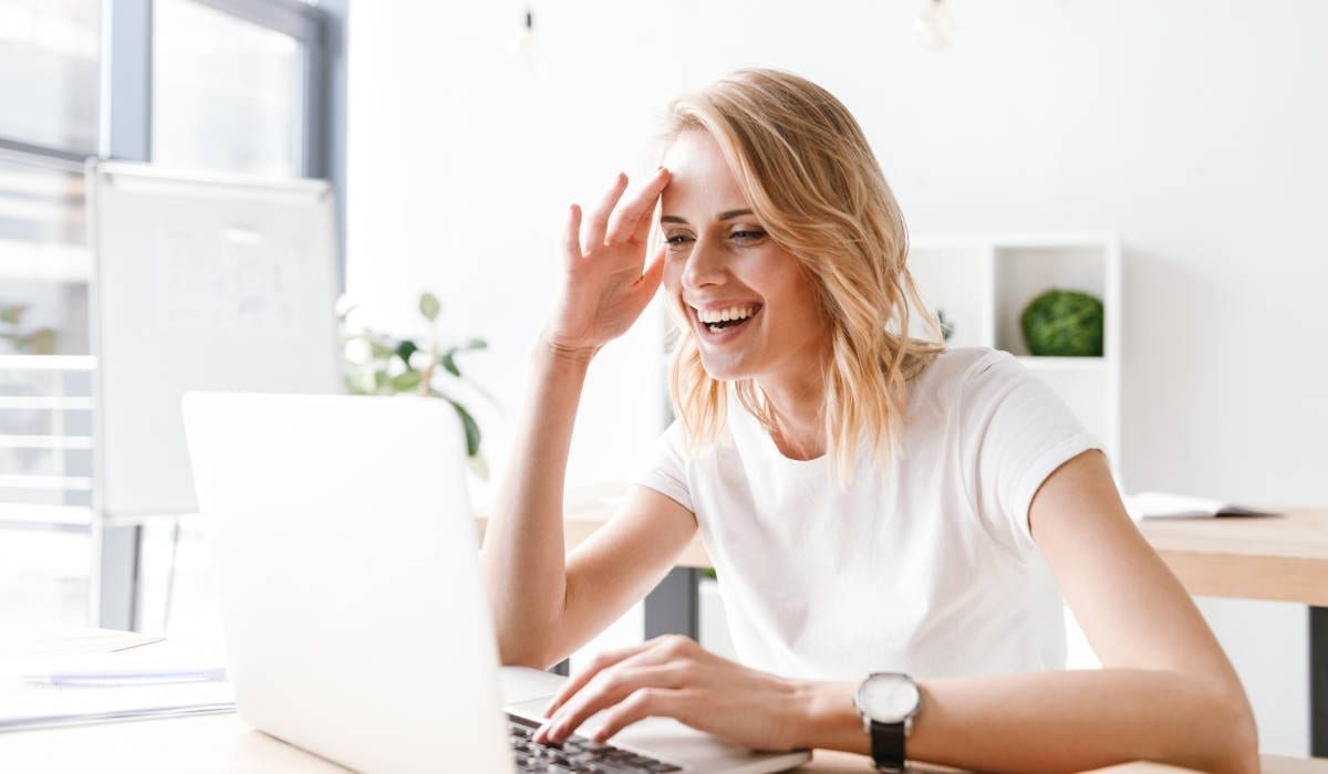 happy Woman on Laptop | Financial Information | Second Mortgage