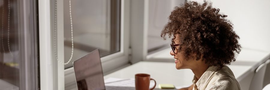 african-american-woman-concentrated-looking-at-com-caveat-loans-tiger-finance