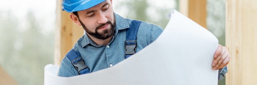 Builder looking at construction plans| Financial Information | Tiger Finance