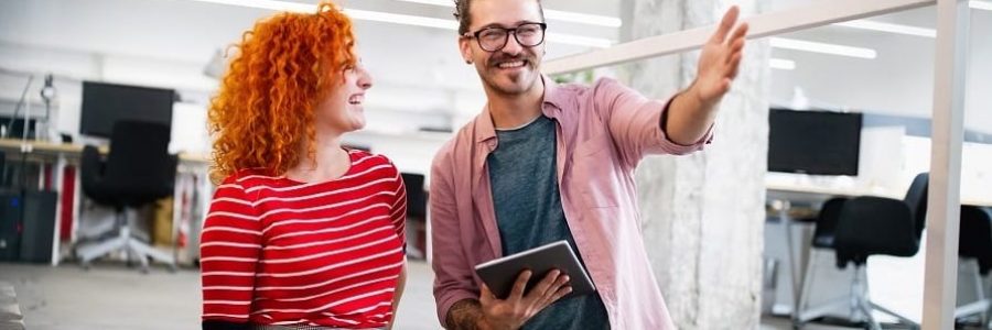 Smiling business partners approved for a development loan| Financial Information | Tiger Finance