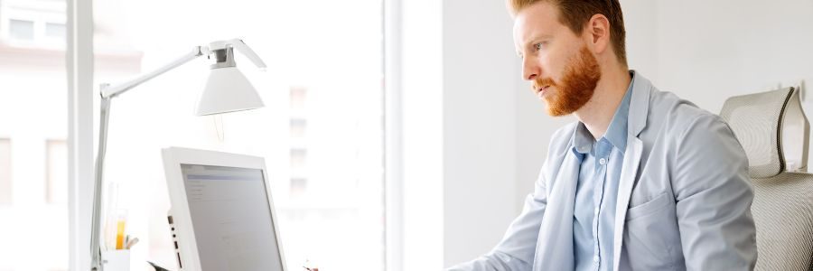 business-person-working-on-computer-caveat-loans-tiger-finance