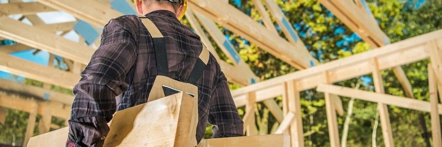 Construction worker carrying materials | Financial Information | Construction Loans