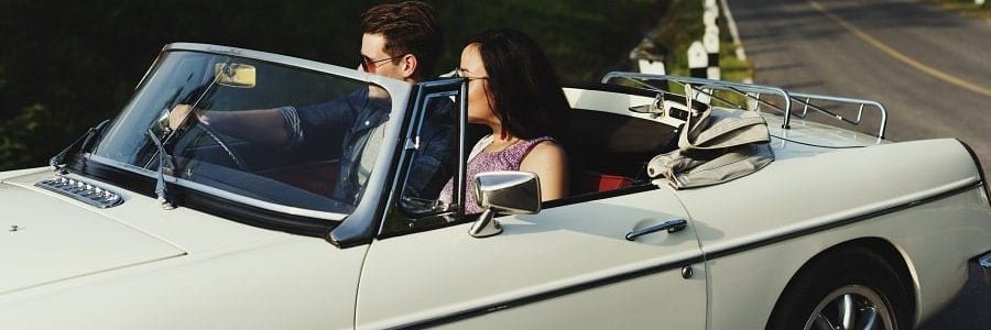 happy couple driving in a new car | Financial Information | Tiger Finance