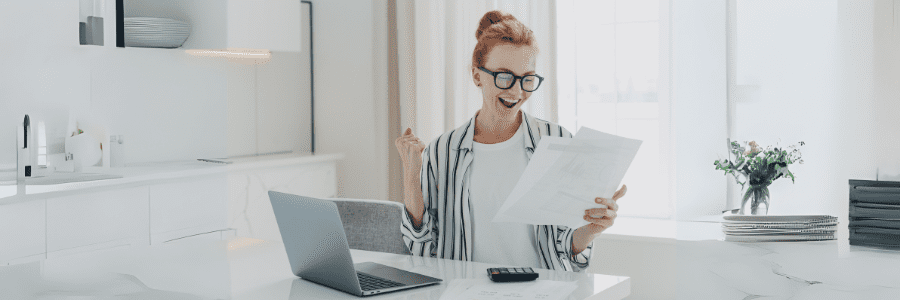 emotional-happy-young-ginger-woman-holding-paper-w-2023-11-27-05-29-36-utc new