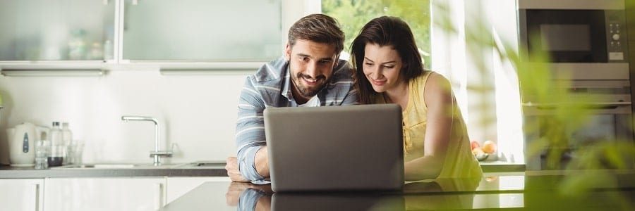 Happy couple looking at the requirements for a boat loan | Financial Information | Tiger Finance