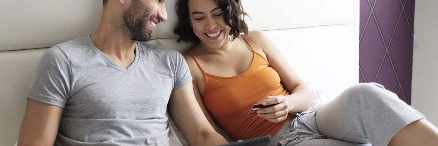 Happy couple looking at loans | Financial Information | Tiger Finance