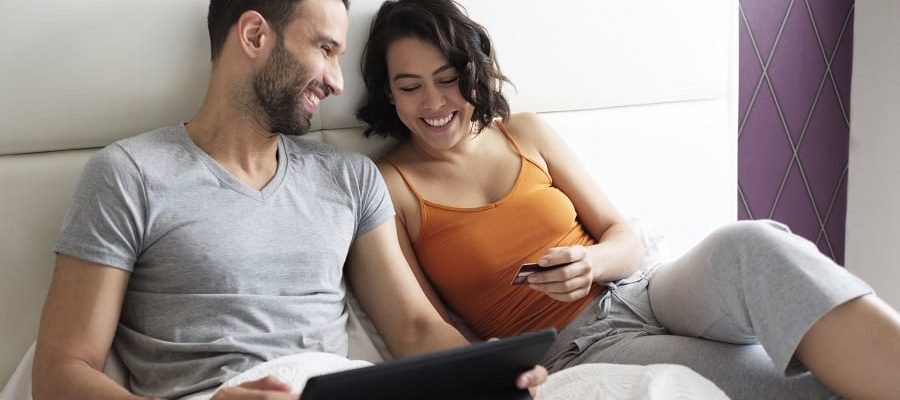 Happy couple looking at loans | Financial Information | Tiger Finance