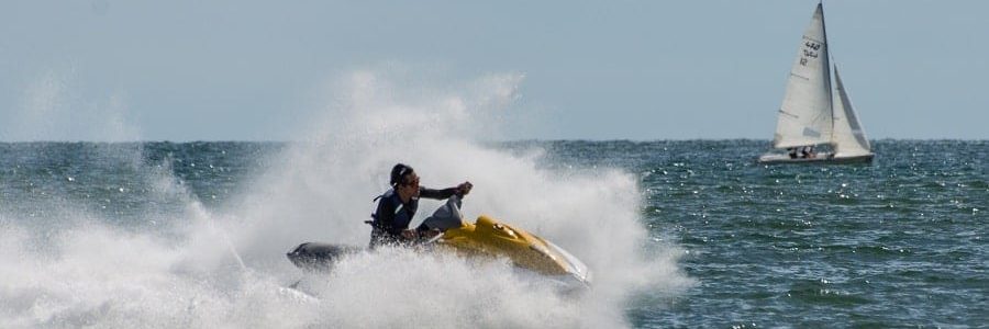 Man having fun on his purchased jet ski | Financial Information | Tiger Finance