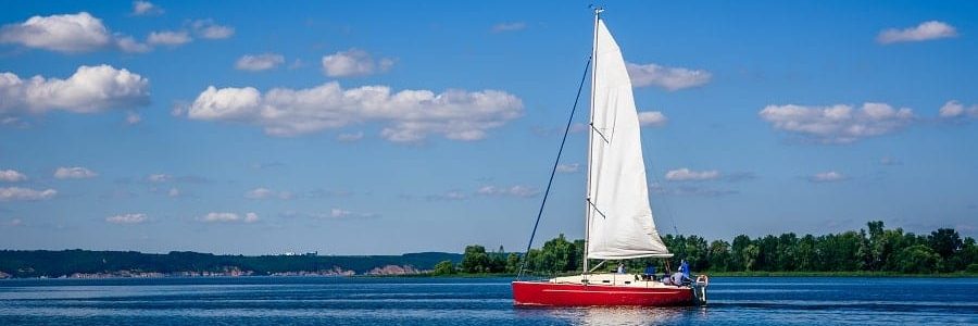 Family on a sail boat after getting a loan | Financial Information | Tiger Finance