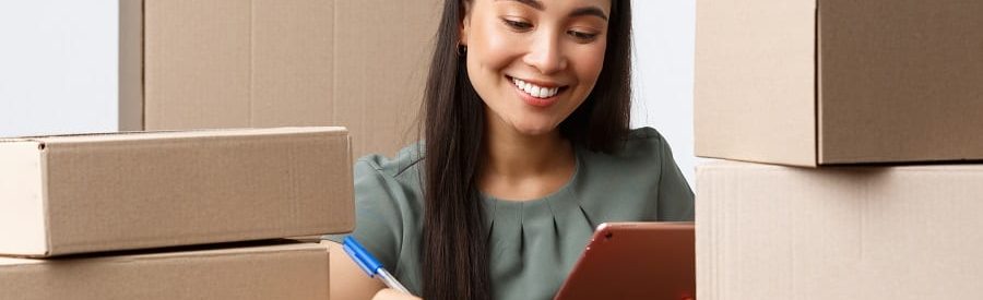 Smiling woman using tablet to research private loans | Financial Information | Private Loans