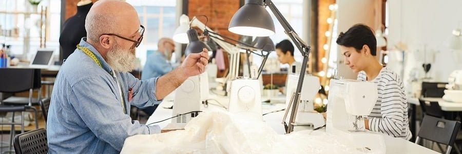 Tailor sewing in his workshop | Financial Information | Tiger Finance