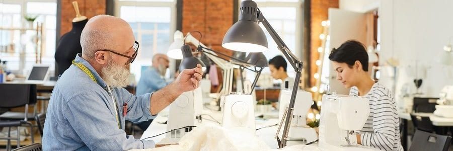 Tailor sewing in workshop | Financial Information | Tiger Finance