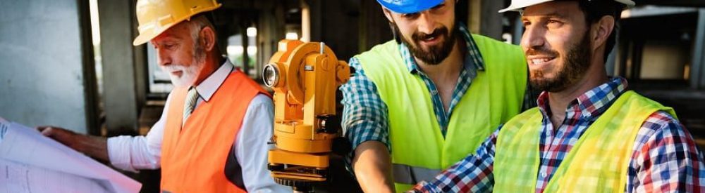 Development engineers talking at a building site | Financial Information | Tiger Finance