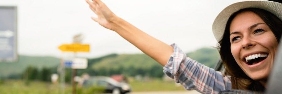 Happy woman riding in car | Financial Information | Tiger Finance