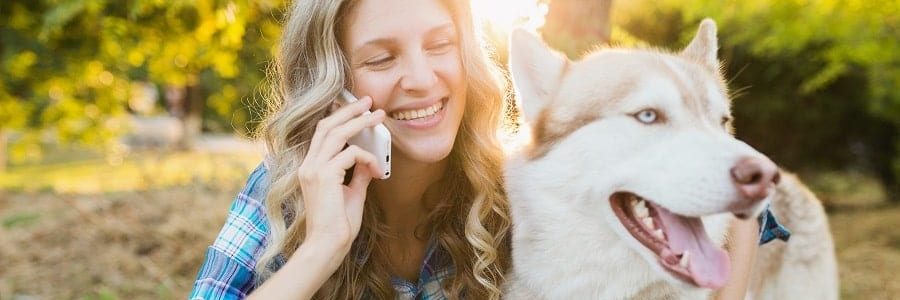 Woman applying for a new caravan loan with her dog outside | Financial Information | Tiger Finance