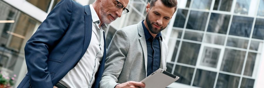 Old and young businessmen discussing resilience in business