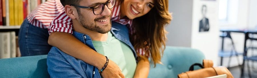 young-happy-couple-with-laptop-at-homehow-do-new-home-construction-loans-work?