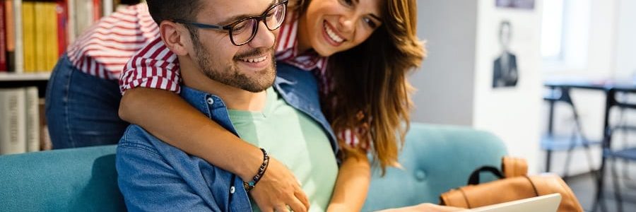 Young Happy Self-Employed Couple With A Laptop | Financial Information | Self-Employed Loans